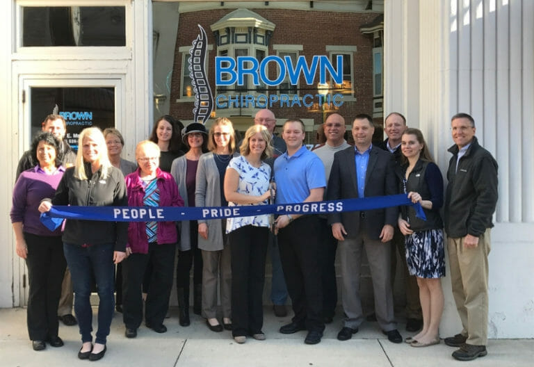 Darke County Ohio Chiropractor - Opening day of office outside banner representatives